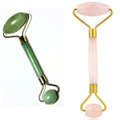 One jade and one pink beauty facial massage rollers with gold accents, displayed against a white background.